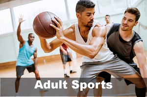 A group of adult men playing basektball